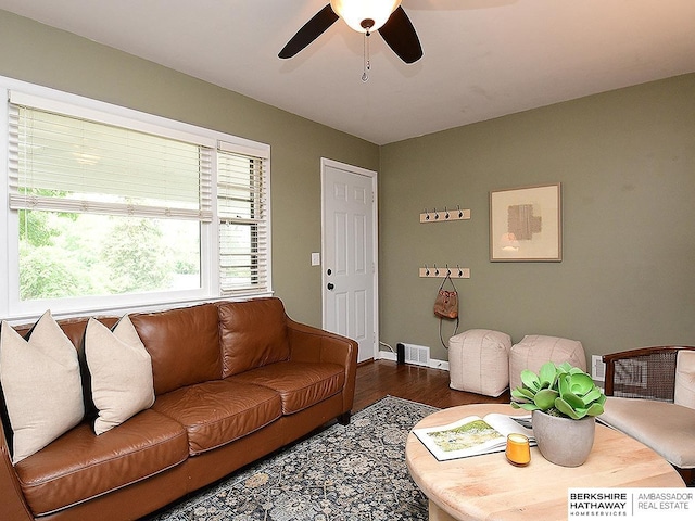 6144 Seward St, Omaha, NE 68104 - living area featuring wood finished floors, ceiling fan, and baseboards