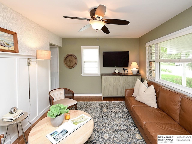 6144 Seward St, Omaha, NE 68104 - living room featuring ceiling fan, plenty of natural light, wood finished floors, and baseboards