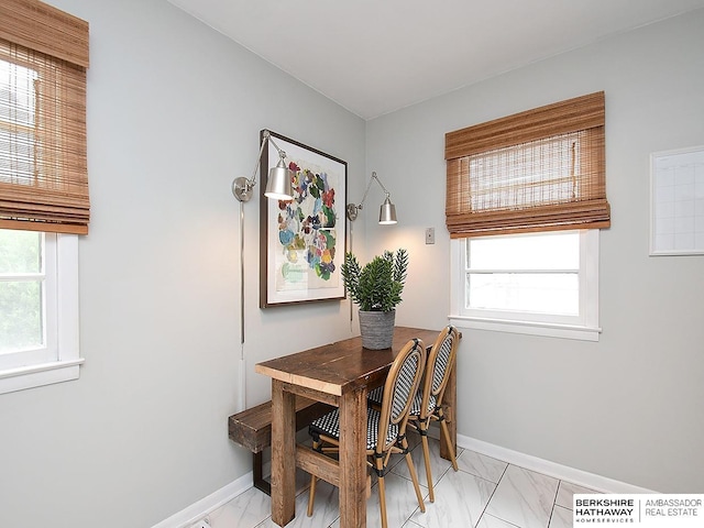 6144 Seward St, Omaha, NE 68104 - dining area featuring light marble finish floors and baseboards
