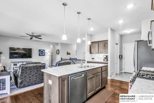 14807 S 24th St, Bellevue, NE 68123 - kitchen featuring appliances with stainless steel finishes, a sink, ceiling fan, light countertops, and recessed lighting