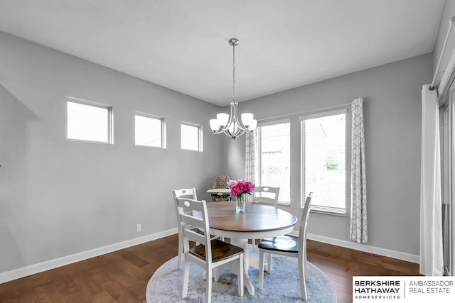 14807 S 24th St, Bellevue, NE 68123 - dining area featuring a chandelier, baseboards, and wood finished floors