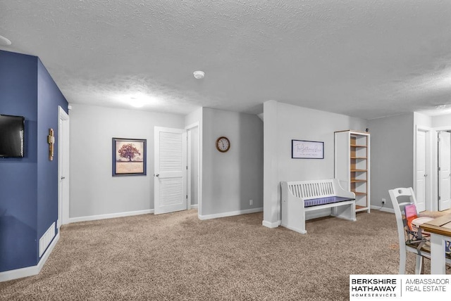 14807 S 24th St, Bellevue, NE 68123 - game room featuring a textured ceiling, carpet floors, and baseboards