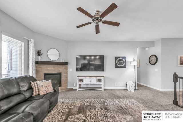 14807 S 24th St, Bellevue, NE 68123 - living room with carpet, ceiling fan, a fireplace, and baseboards