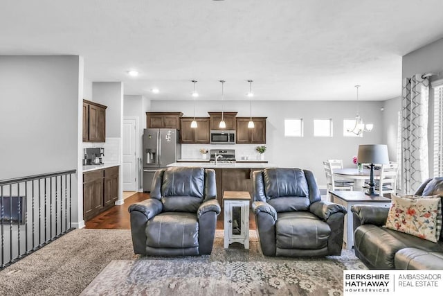 14807 S 24th St, Bellevue, NE 68123 - living area featuring a chandelier and recessed lighting