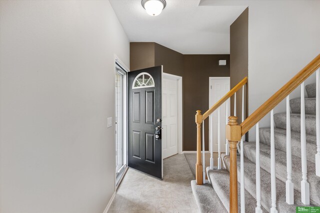 4602 N 155th Ave, Omaha, NE 68116 - foyer entrance featuring stairs and baseboards