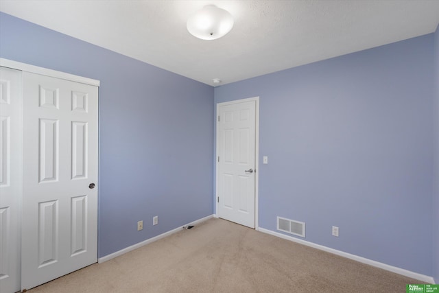 4602 N 155th Ave, Omaha, NE 68116 - unfurnished bedroom featuring carpet floors, baseboards, and a closet