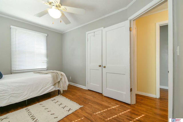920 Clark Ave, Lincoln, NE 68510 - bedroom featuring ornamental molding, wood finished floors, baseboards, and a ceiling fan