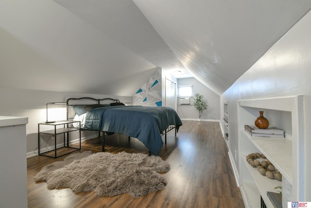 920 Clark Ave, Lincoln, NE 68510 - bedroom with lofted ceiling, wood finished floors, baseboards, and cooling unit