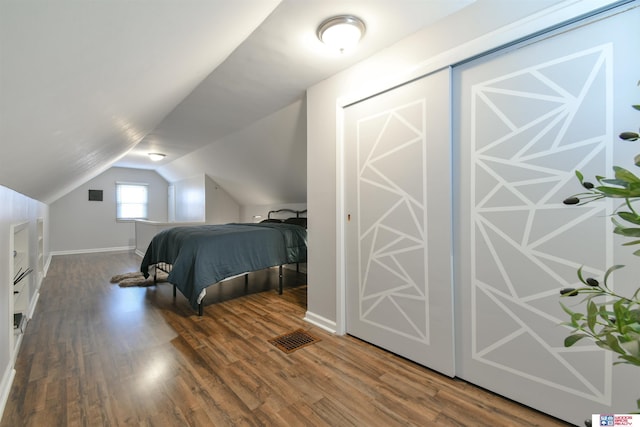 920 Clark Ave, Lincoln, NE 68510 - bedroom featuring wood finished floors and vaulted ceiling