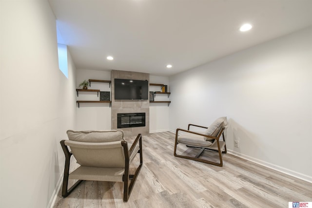 920 Clark Ave, Lincoln, NE 68510 - living room with light wood-style flooring, a fireplace, recessed lighting, and baseboards