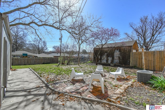 920 Clark Ave, Lincoln, NE 68510 - view of yard featuring a patio and central AC unit