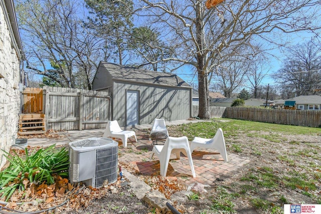 920 Clark Ave, Lincoln, NE 68510 - view of yard featuring central AC unit, a patio area, and an outbuilding