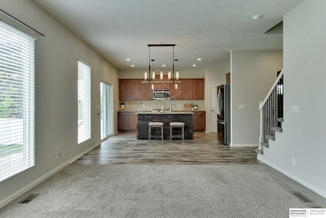 18337 Polk St, Omaha, NE 68135 - kitchen featuring appliances with stainless steel finishes, light countertops, healthy amount of natural light, baseboards, and recessed lighting