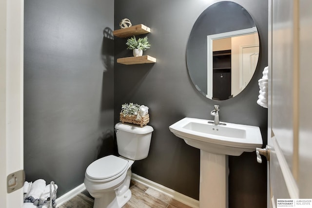 18337 Polk St, Omaha, NE 68135 - half bath featuring toilet, wood finished floors, and baseboards
