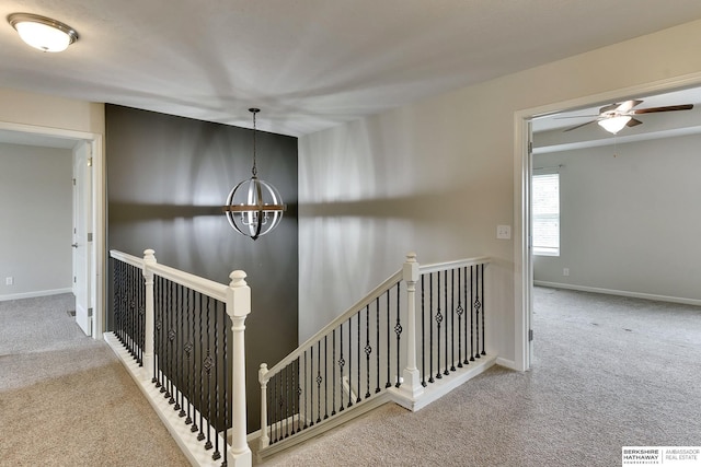 18337 Polk St, Omaha, NE 68135 - hallway with an upstairs landing, carpet floors, a chandelier, and baseboards