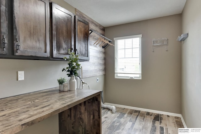 18337 Polk St, Omaha, NE 68135 - laundry area featuring cabinet space, wood finished floors, baseboards, and hookup for an electric dryer