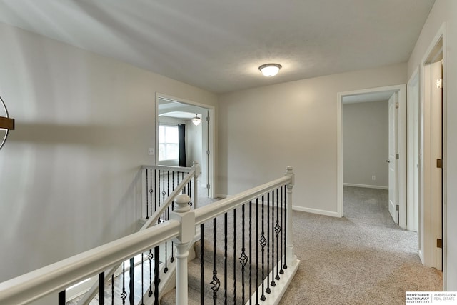 18337 Polk St, Omaha, NE 68135 - hallway featuring an upstairs landing, carpet floors, and baseboards