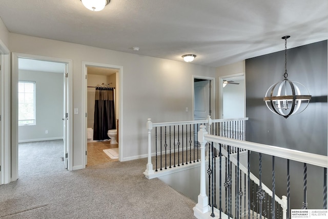 18337 Polk St, Omaha, NE 68135 - hallway featuring an upstairs landing, carpet floors, and baseboards