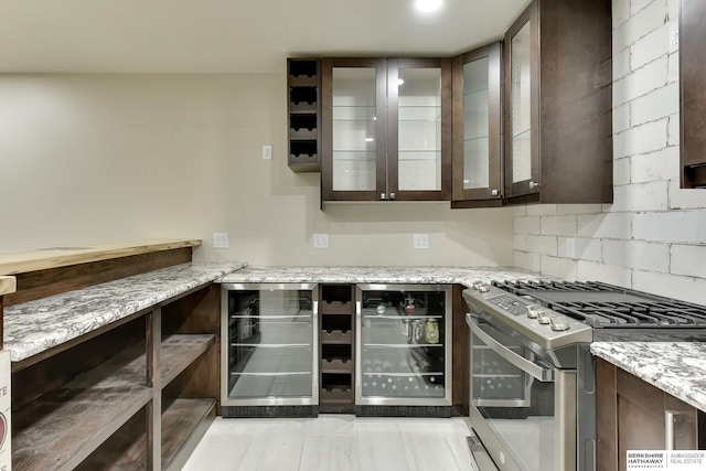 18337 Polk St, Omaha, NE 68135 - kitchen featuring stainless steel gas stove, beverage cooler, dark brown cabinetry, and light stone counters