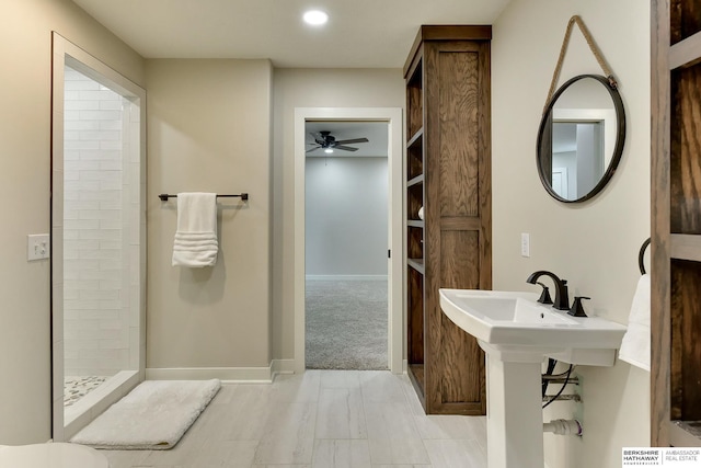 18337 Polk St, Omaha, NE 68135 - full bathroom with tiled shower, ceiling fan, baseboards, recessed lighting, and a sink
