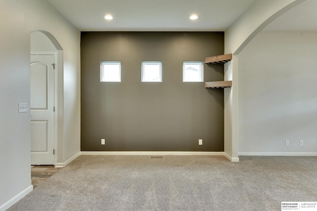 18337 Polk St, Omaha, NE 68135 - carpeted spare room with arched walkways, recessed lighting, and baseboards