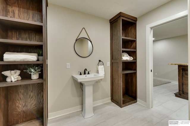 18337 Polk St, Omaha, NE 68135 - bathroom featuring baseboards and a sink