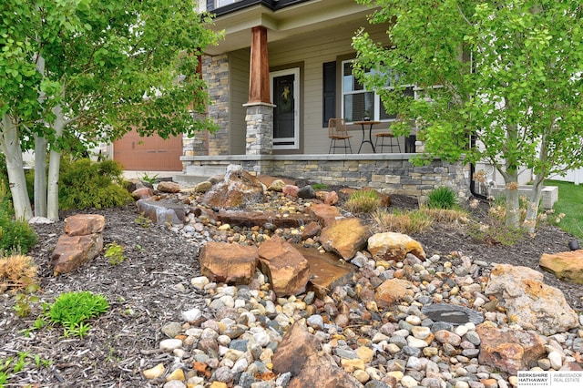 18337 Polk St, Omaha, NE 68135 - property entrance with a porch and stone siding