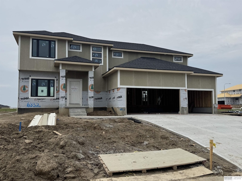 6332 N 207th St, Elkhorn, NE 68022 - view of front of house featuring a garage and driveway