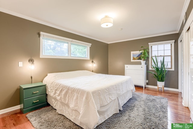 1008 J E George Blvd, Omaha, NE 68132 - bedroom featuring crown molding, light wood-style flooring, and baseboards