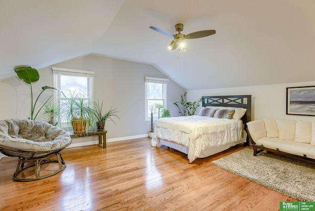 1008 J E George Blvd, Omaha, NE 68132 - bedroom featuring multiple windows, light wood finished floors, lofted ceiling, a ceiling fan, and baseboards