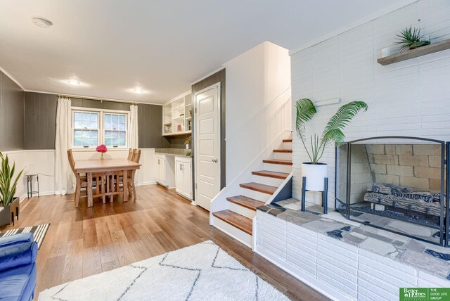 1008 J E George Blvd, Omaha, NE 68132 - living area with light wood finished floors, stairway, and recessed lighting