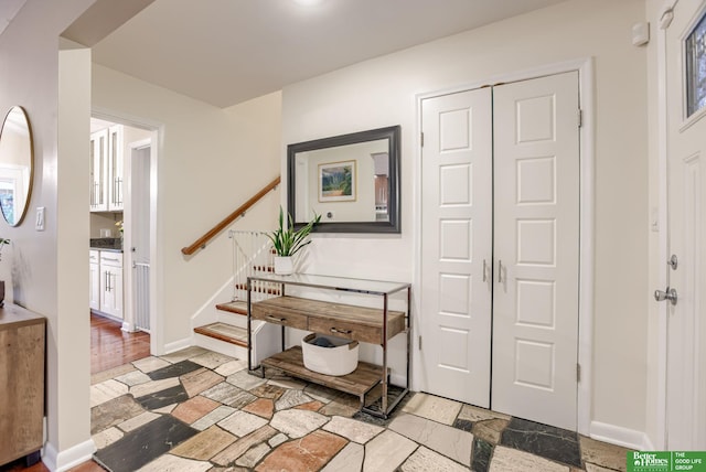 1008 J E George Blvd, Omaha, NE 68132 - entryway featuring stairs and baseboards