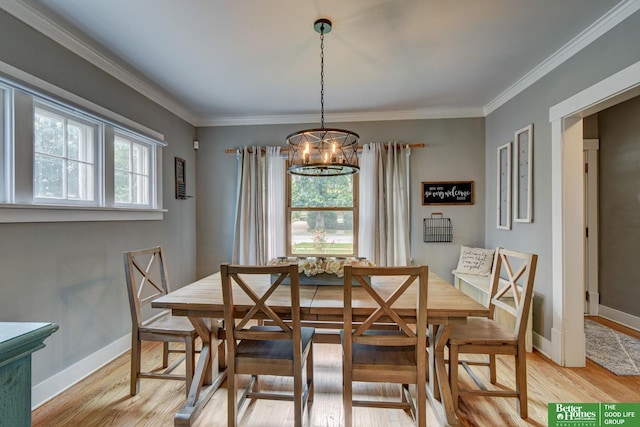 406 S 49th St, Omaha, NE 68132 - dining space with light wood finished floors, a chandelier, baseboards, and ornamental molding