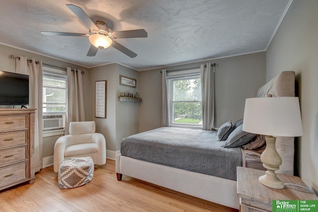 406 S 49th St, Omaha, NE 68132 - bedroom featuring light wood-type flooring, cooling unit, ornamental molding, ceiling fan, and baseboards
