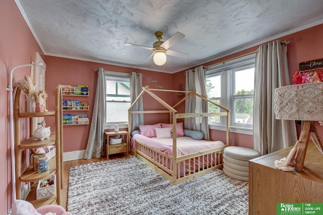 406 S 49th St, Omaha, NE 68132 - bedroom with multiple windows, ornamental molding, wood finished floors, ceiling fan, and baseboards