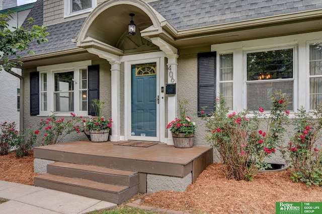 406 S 49th St, Omaha, NE 68132 - property entrance with a shingled roof and stucco siding