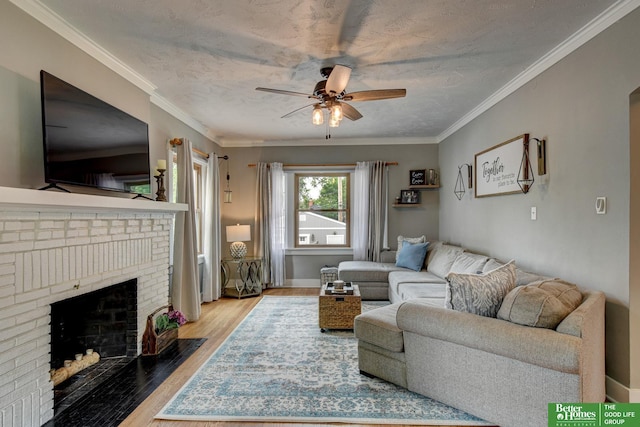 406 S 49th St, Omaha, NE 68132 - living room with a ceiling fan, wood finished floors, a brick fireplace, crown molding, and baseboards