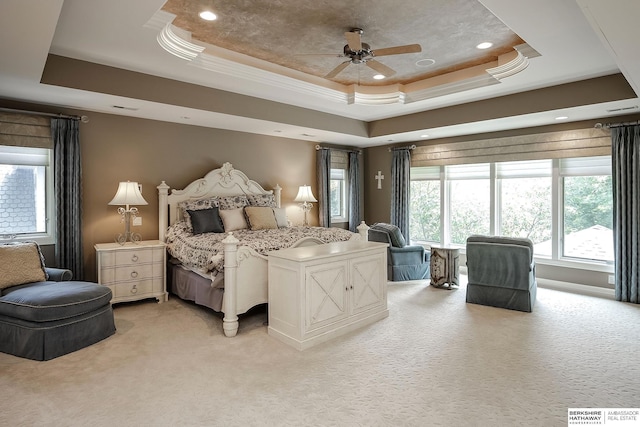 12829 Izard St, Omaha, NE 68154 - bedroom featuring a raised ceiling, light colored carpet, recessed lighting, crown molding, and a ceiling fan