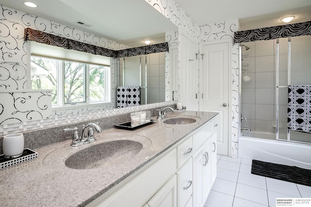 12829 Izard St, Omaha, NE 68154 - full bath featuring tile patterned flooring, enclosed tub / shower combo, and double vanity