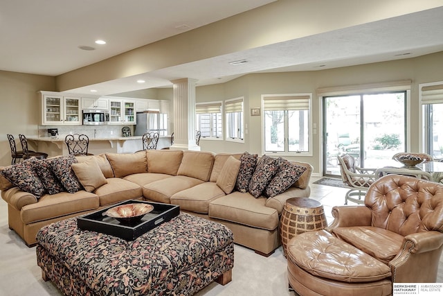 12829 Izard St, Omaha, NE 68154 - living room with decorative columns, recessed lighting, and light carpet