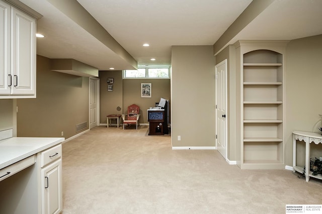 12829 Izard St, Omaha, NE 68154 - interior space featuring light colored carpet, recessed lighting, baseboards, and built in features