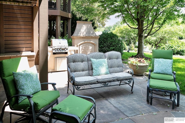 12829 Izard St, Omaha, NE 68154 - view of patio / terrace with an outdoor fireplace