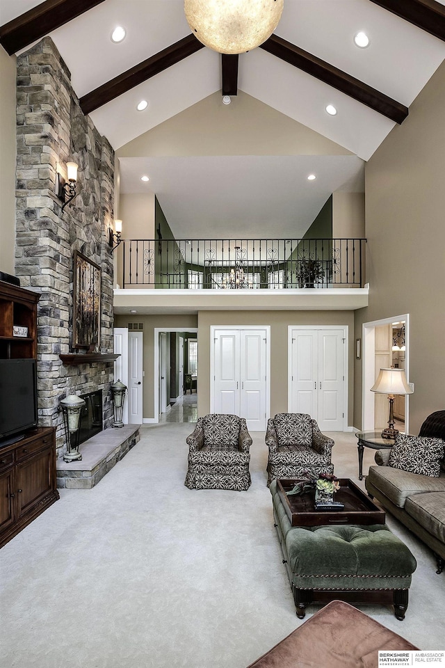 12829 Izard St, Omaha, NE 68154 - living room featuring high vaulted ceiling, beam ceiling, a stone fireplace, carpet flooring, and recessed lighting