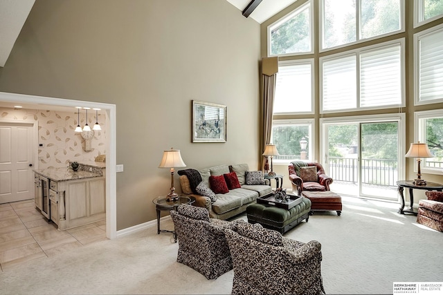 12829 Izard St, Omaha, NE 68154 - living room featuring high vaulted ceiling, light carpet, and baseboards
