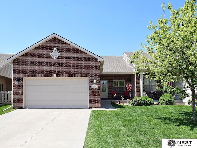 7615 Greycliff Dr, Lincoln, NE 68516 - view of front of house featuring brick siding, driveway, a garage, and a shingled roof