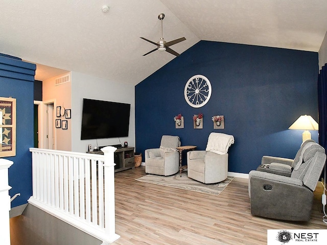 7615 Greycliff Dr, Lincoln, NE 68516 - living area featuring ceiling fan, wood finished floors, vaulted ceiling, and baseboards