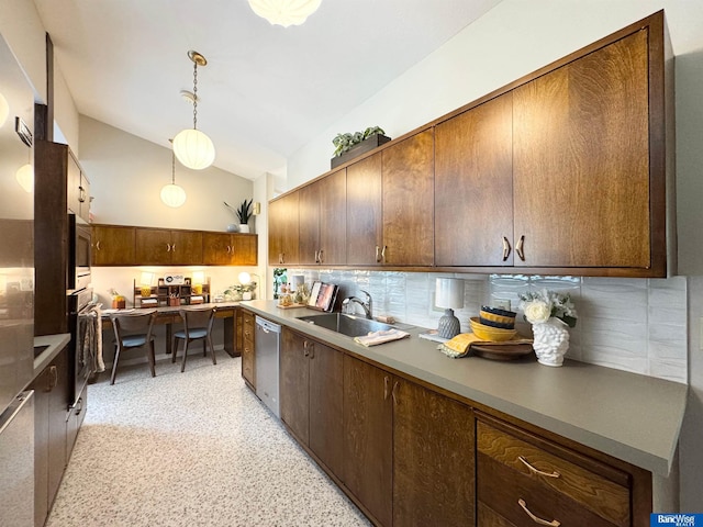 5941 Margo Dr, Lincoln, NE 68510 - kitchen featuring stainless steel appliances, a sink, tasteful backsplash, vaulted ceiling, and dark speckled floor