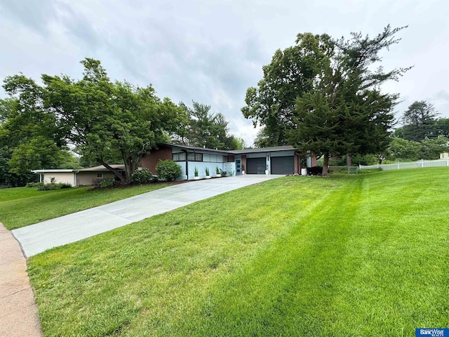 5941 Margo Dr, Lincoln, NE 68510 - mid-century home with driveway and an attached garage