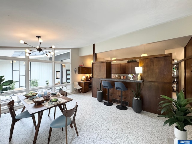 5941 Margo Dr, Lincoln, NE 68510 - dining area with light carpet and a chandelier