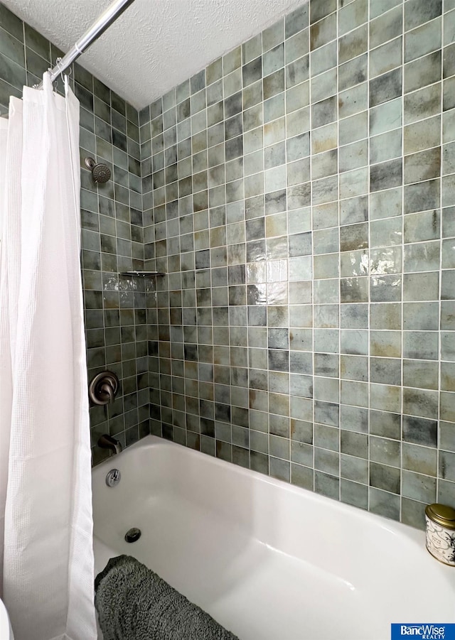 5941 Margo Dr, Lincoln, NE 68510 - bathroom with a textured ceiling and shower / bath combo